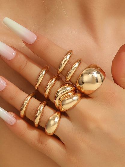 A set of nine uniquely designed, asymmetrical double-layered arc-shaped rings, perfect for women to wear daily or at parties.