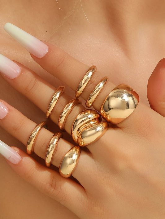 A set of nine uniquely designed, asymmetrical double-layered arc-shaped rings, perfect for women to wear daily or at parties.